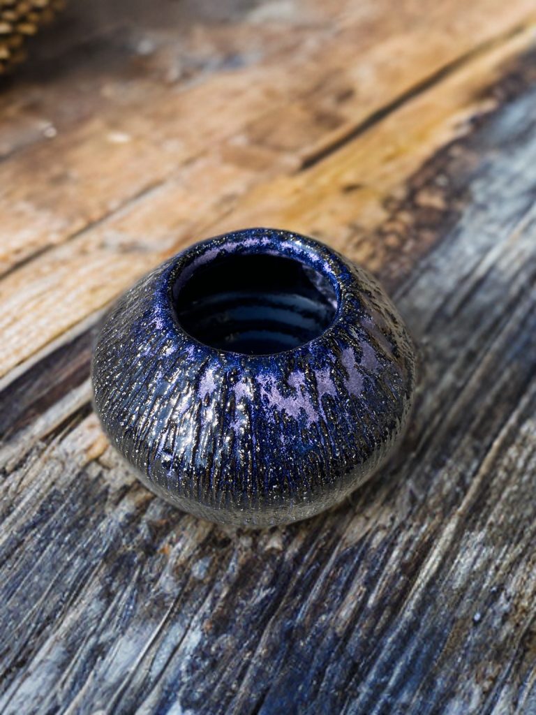 Small vessel with deep midnight blue galaxy glaze